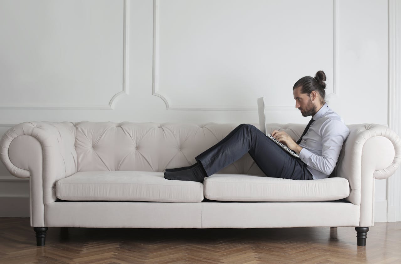 Freelancing Freelancer working remotely on a laptop.
